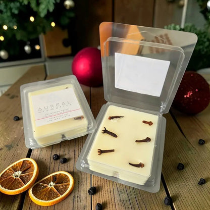 Aureal Christmas Spice soy wax melts with cloves in an open clear pack, orange slices