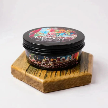 Nanny's Kitchen candle tin on a hexagon wooden stand