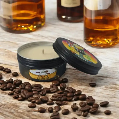 Irish Coffee tin candle among coffee beans, bottles behind