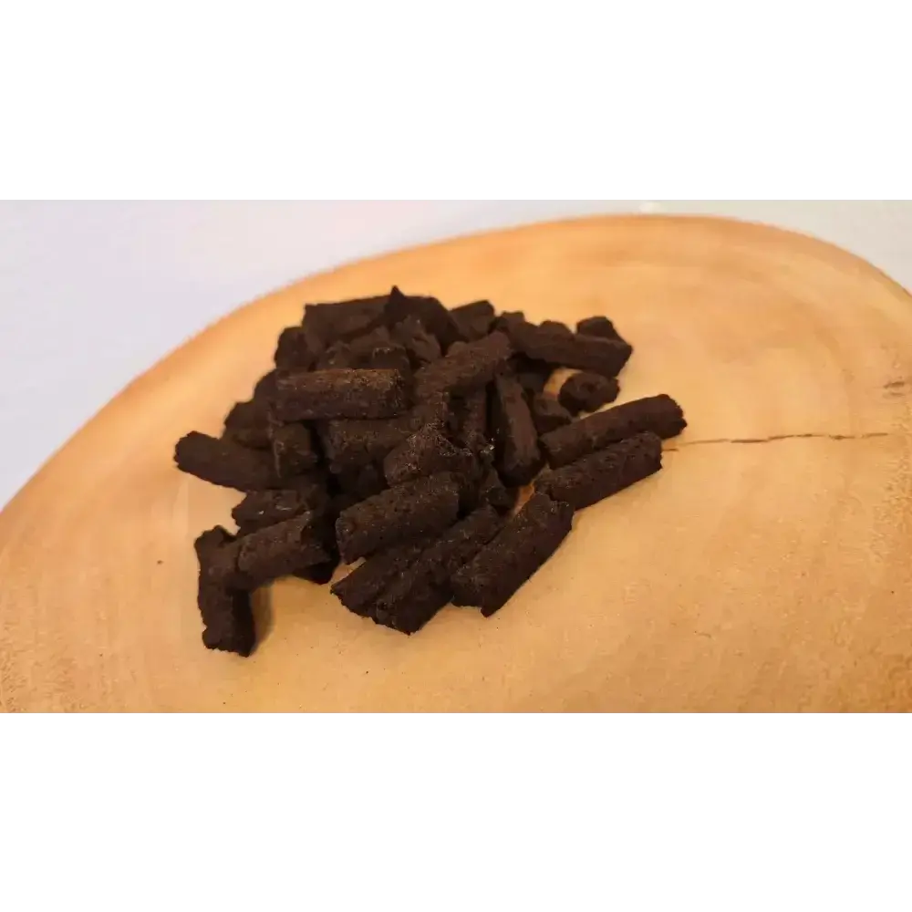 Pile of small Irish turf incense Wee Bits on a wood slice