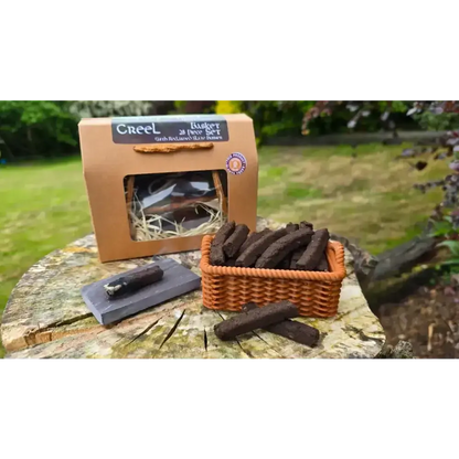 Creel Basket Set box, a small basket of turf sods and a sod on a slate, on a tree stump